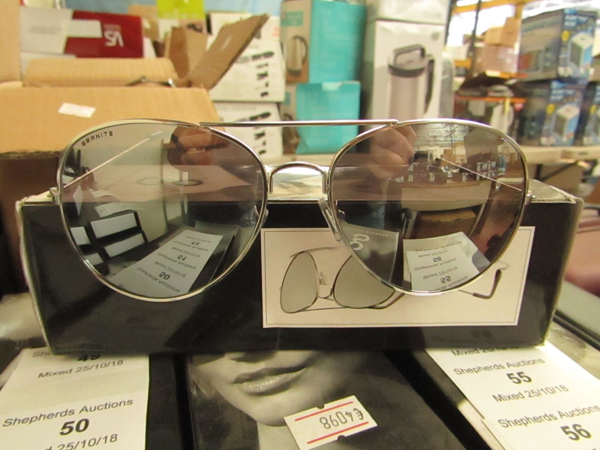 A Pair of Granite Aviator style sunglasses, new and boxed.
