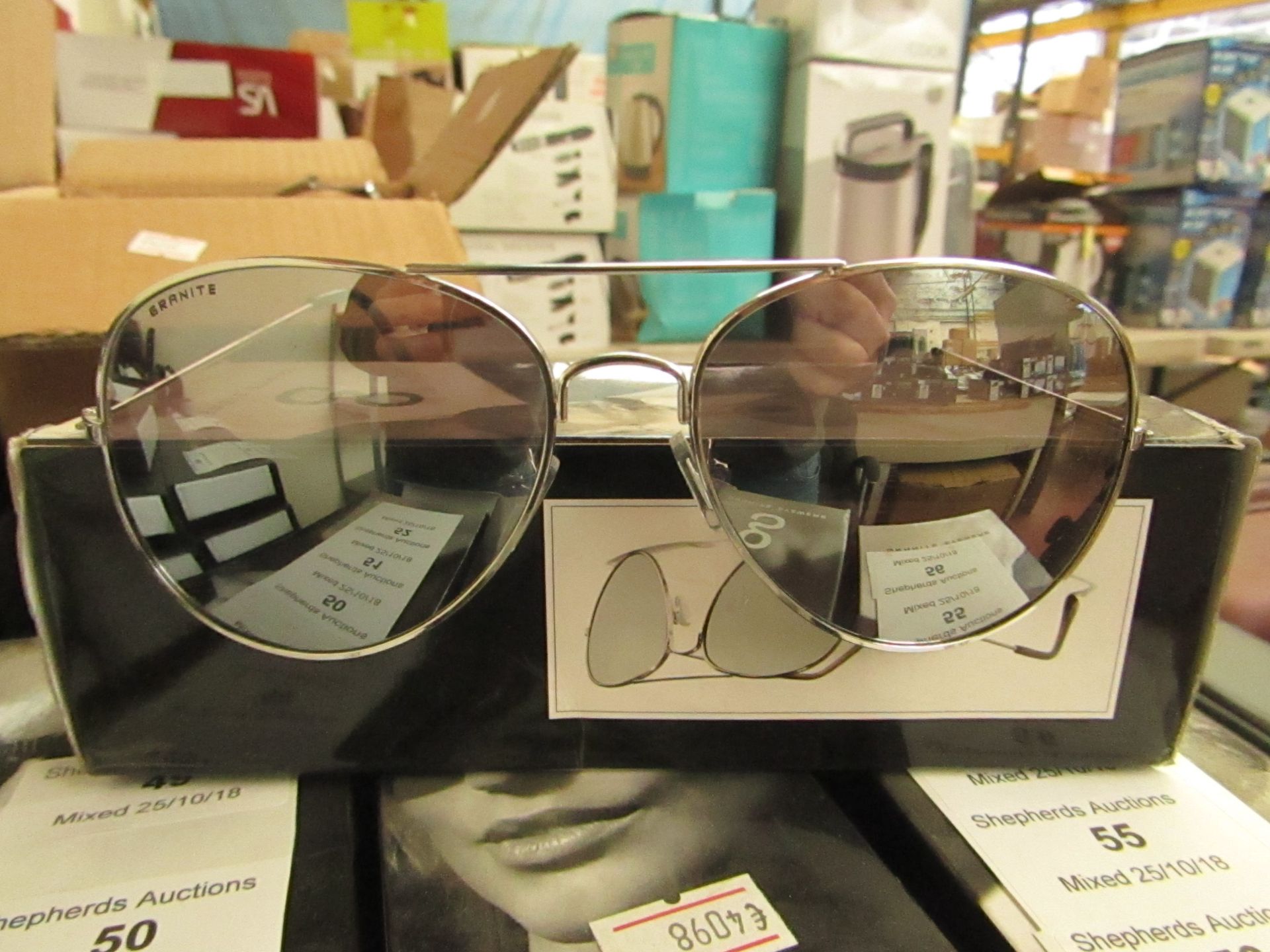 A Pair of Granite Aviator style sunglasses, new and boxed.