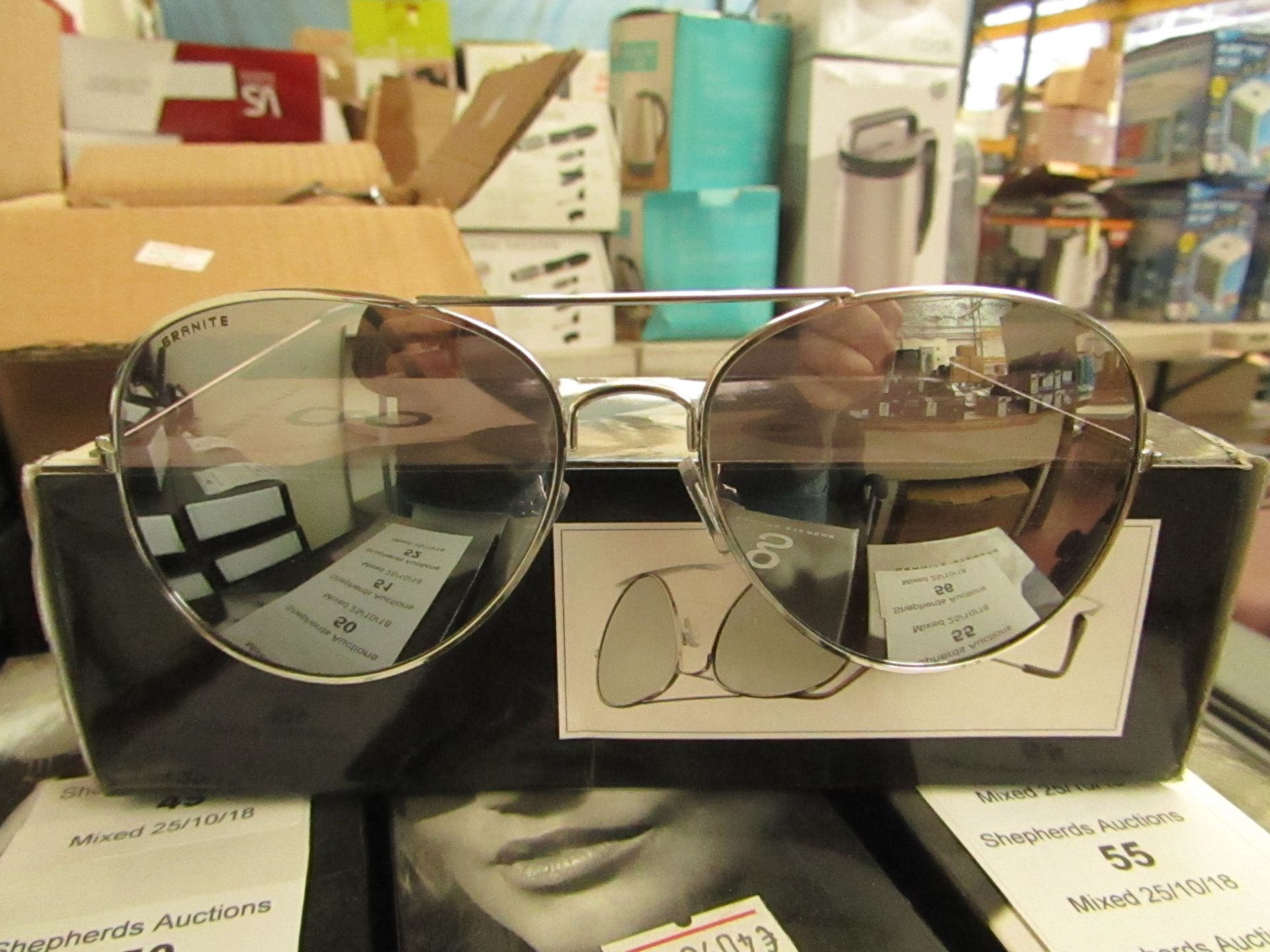 A Pair of Granite Aviator style sunglasses, new and boxed.