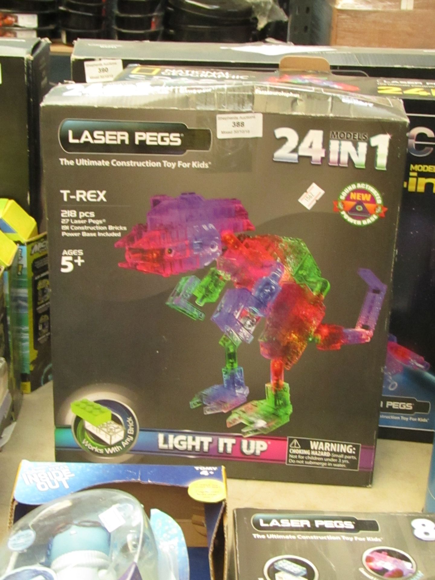 Laser Pegs 24 in 1 T-rex construction set with LEDs. Unchecked and boxed.