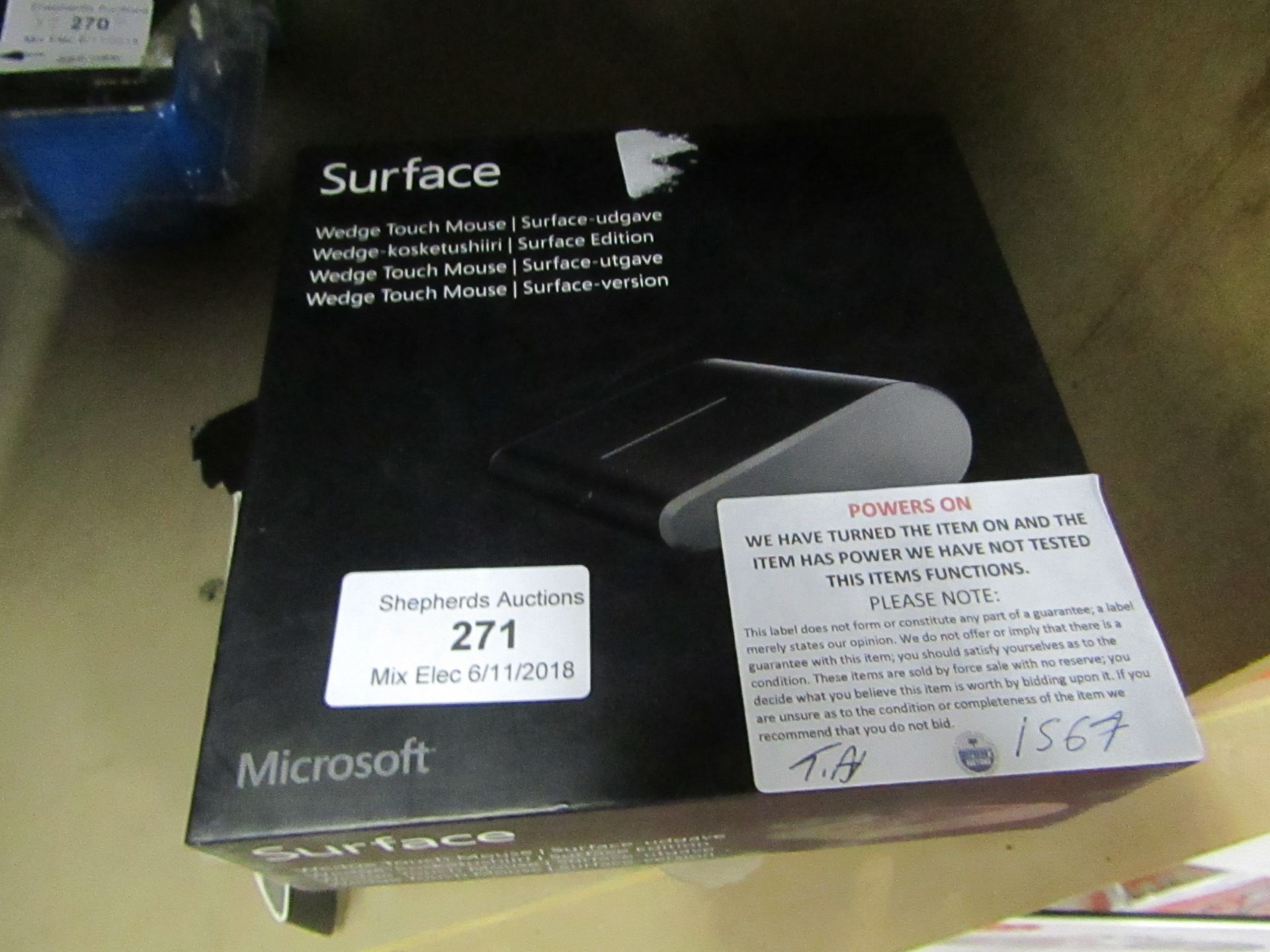 Surface wedge touch mouse, powers on and boxed.