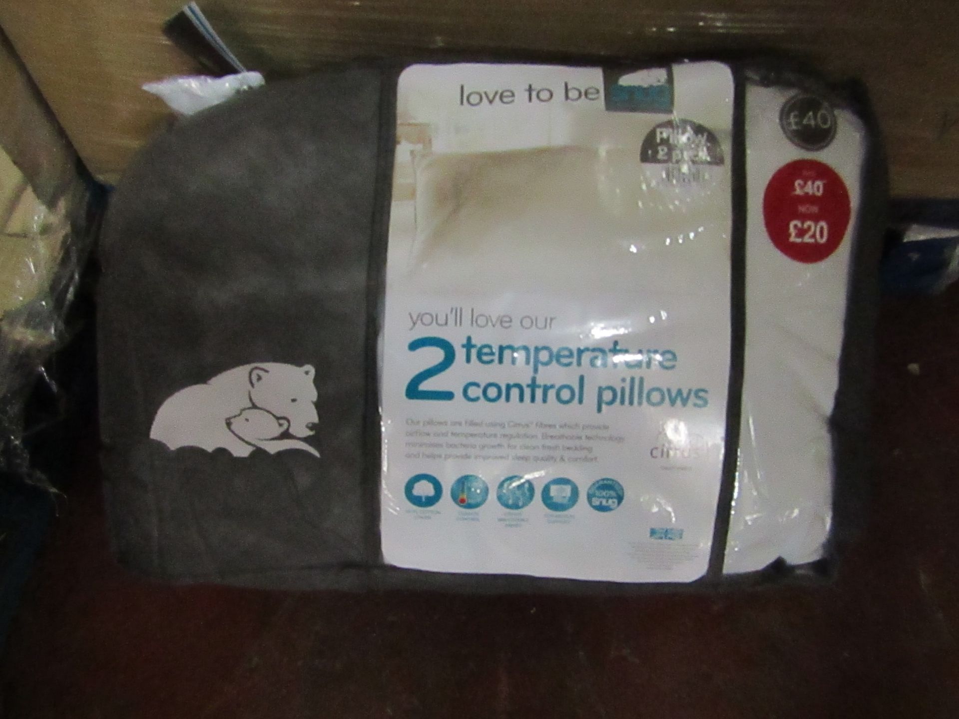 Snug pack of 2 temperature control pillows, brand new and packaged.