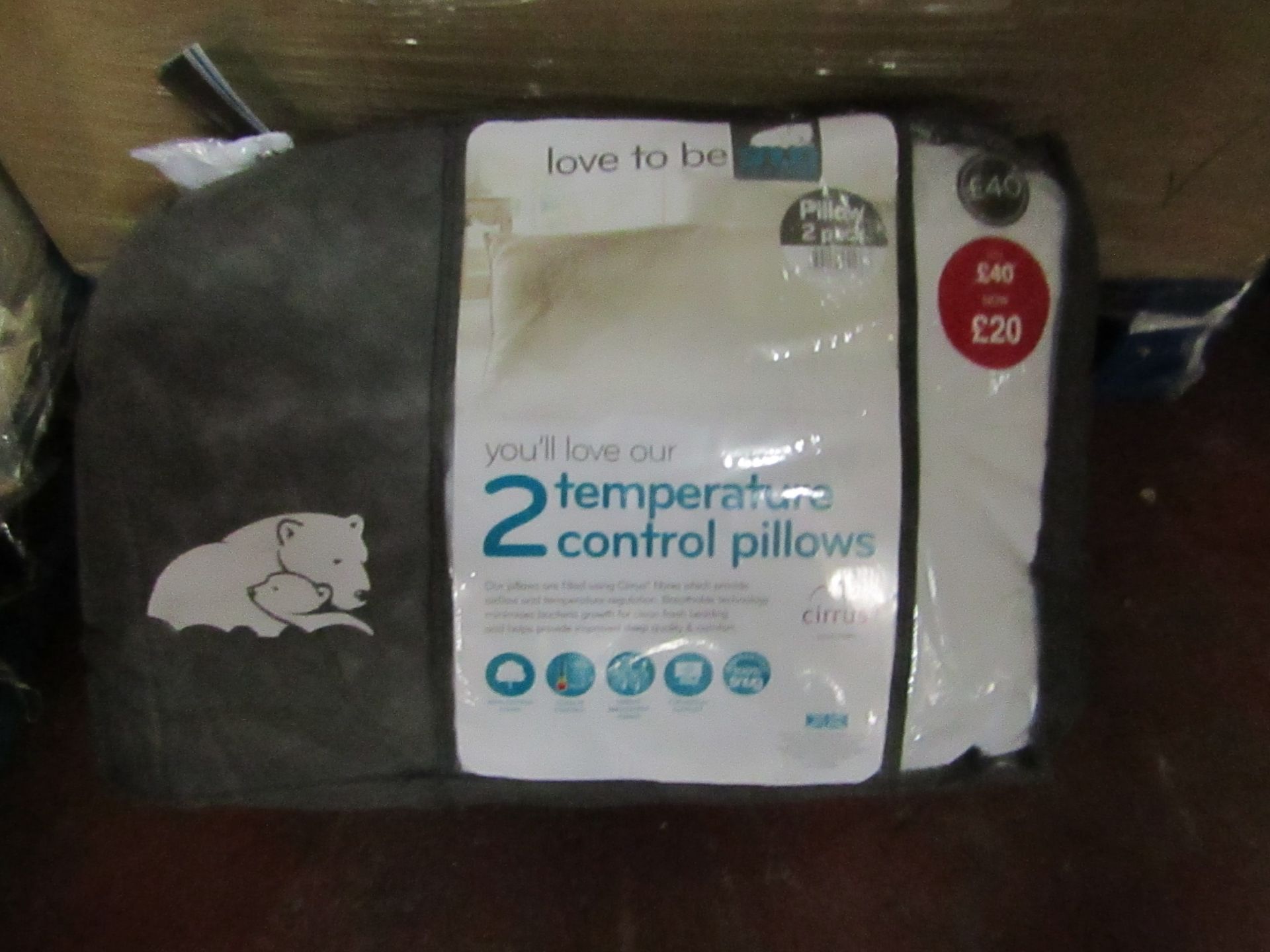 Snug pack of 2 temperature control pillows, brand new and packaged.