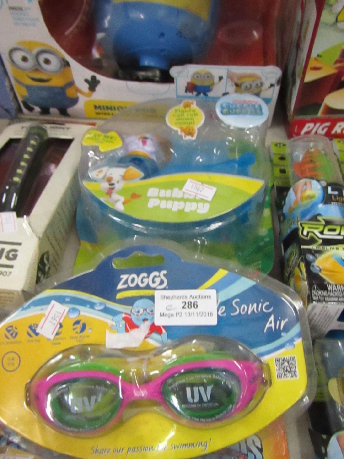 2x Items being; Bubble puppy toy and Zoggs sonic air goggle (0-6yrs). Both new in packaging.