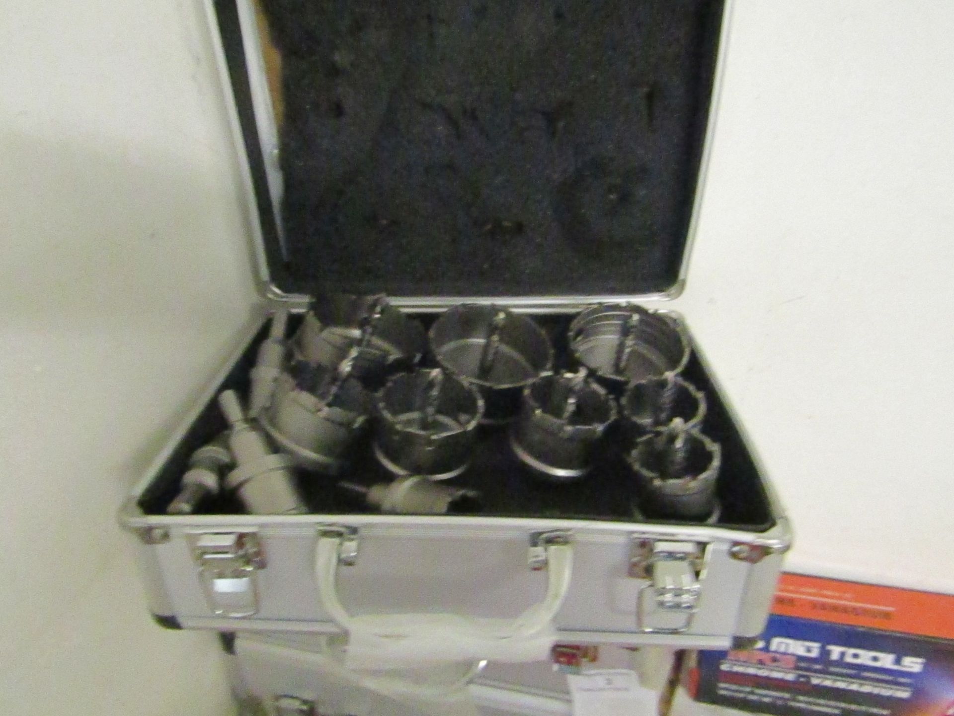 12 piece Hole saw set all with arbours, new in metal effect carry box.