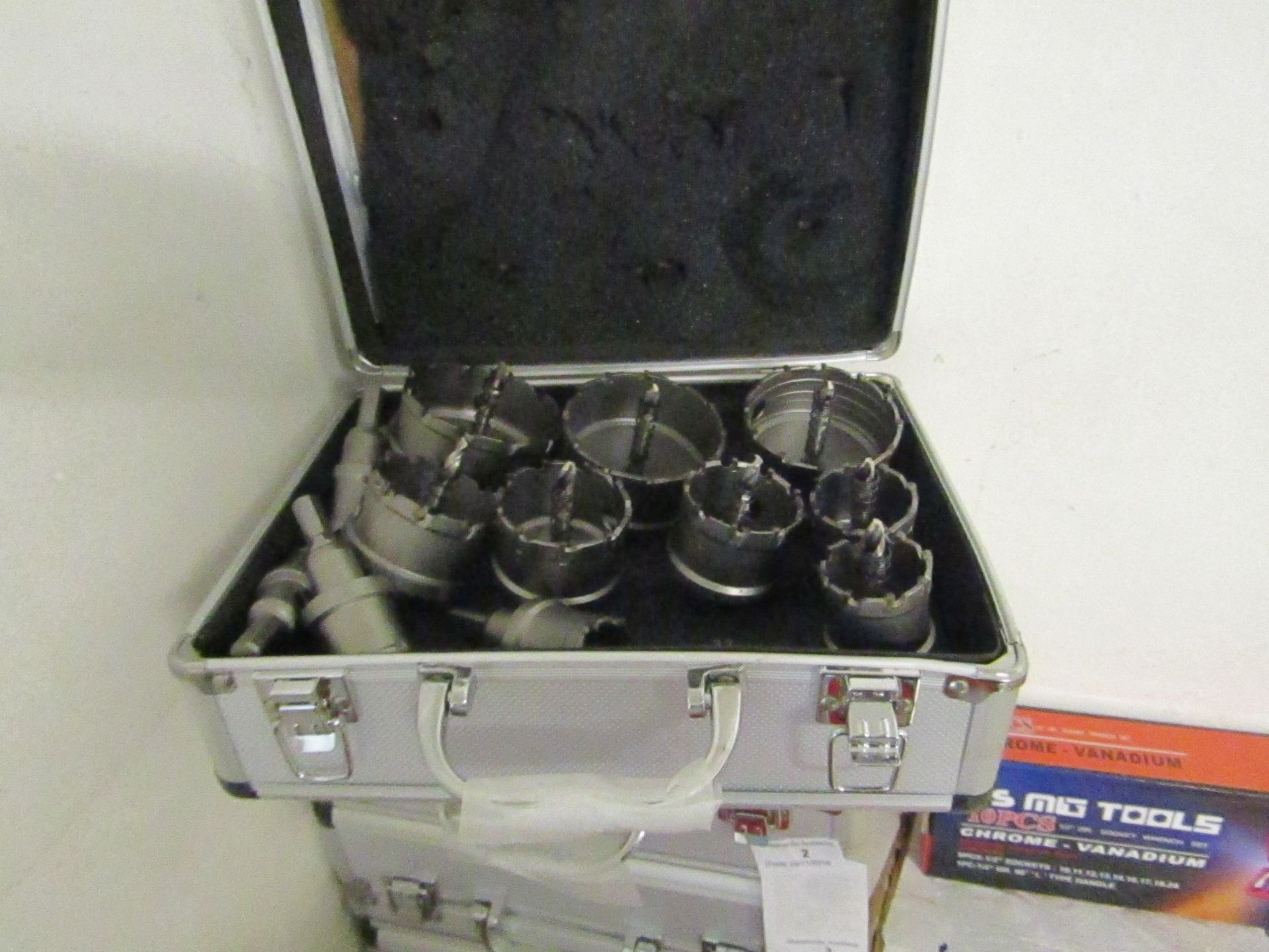 12 piece Hole saw set all with arbours, new in metal effect carry box.