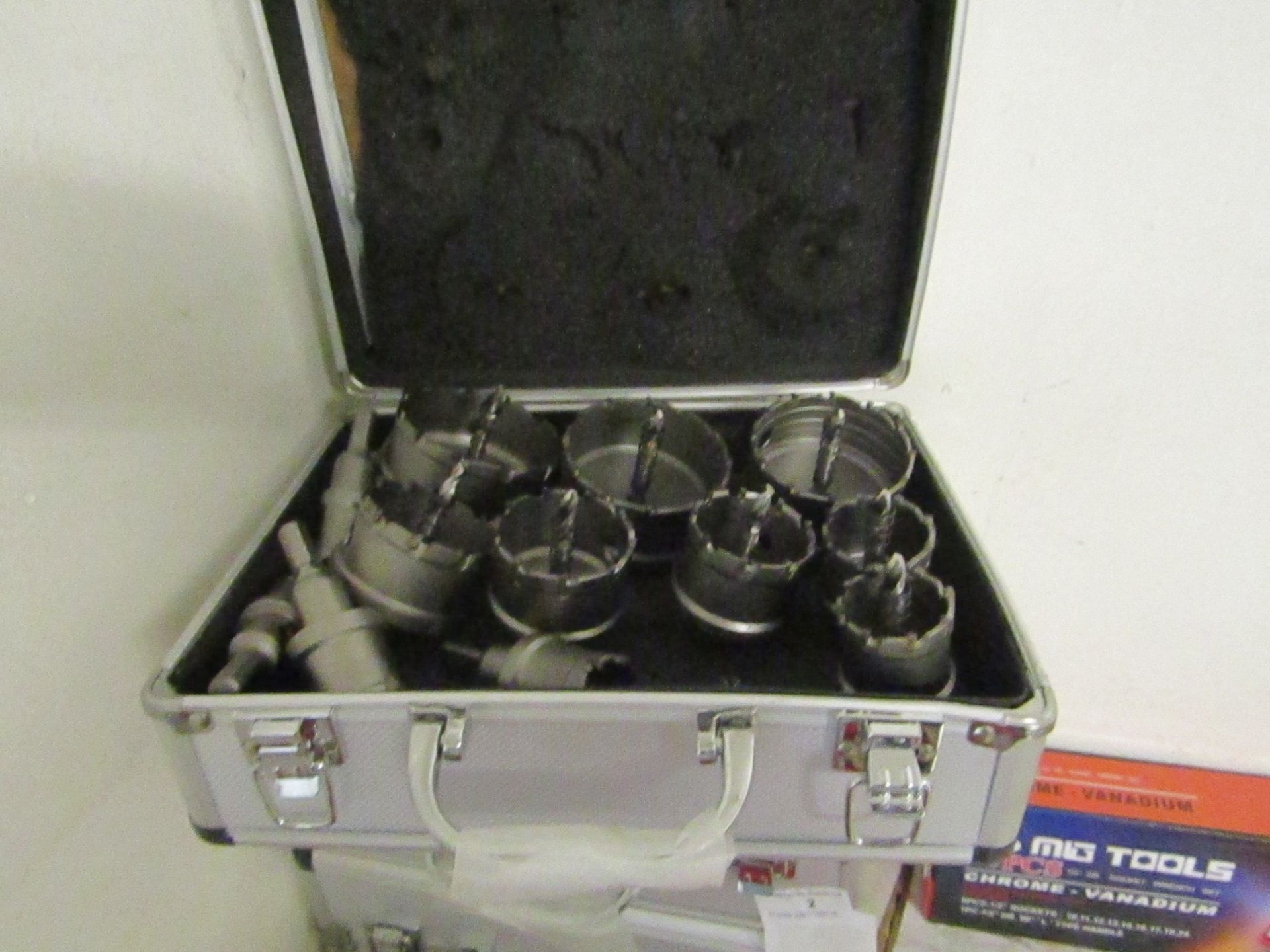 12 piece Hole saw set all with arbours, new in metal effect carry box.