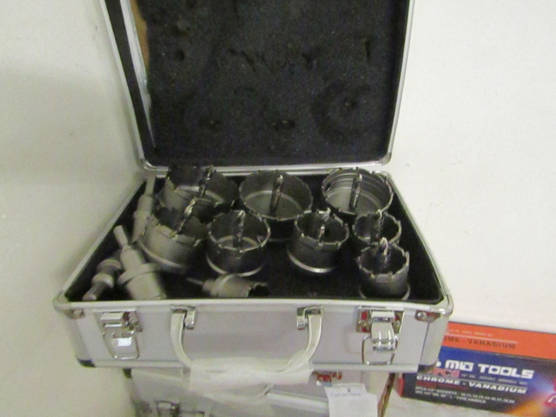 12 piece Hole saw set all with arbours, new in metal effect carry box.