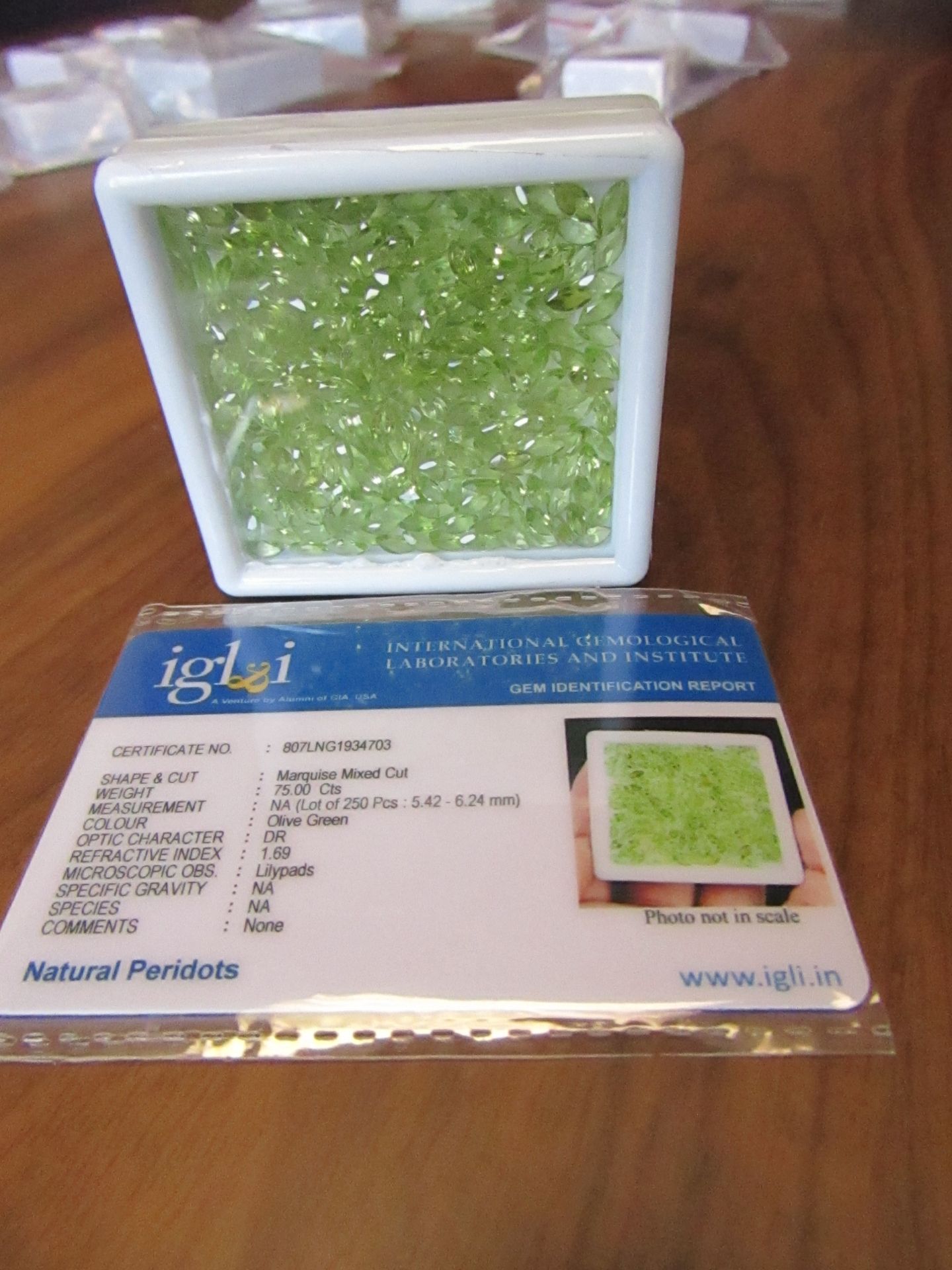250 pieces Olive Green Natural Peridots. Marquise Mixed Cut. Total Weight 75.00 Carats. As per Gem