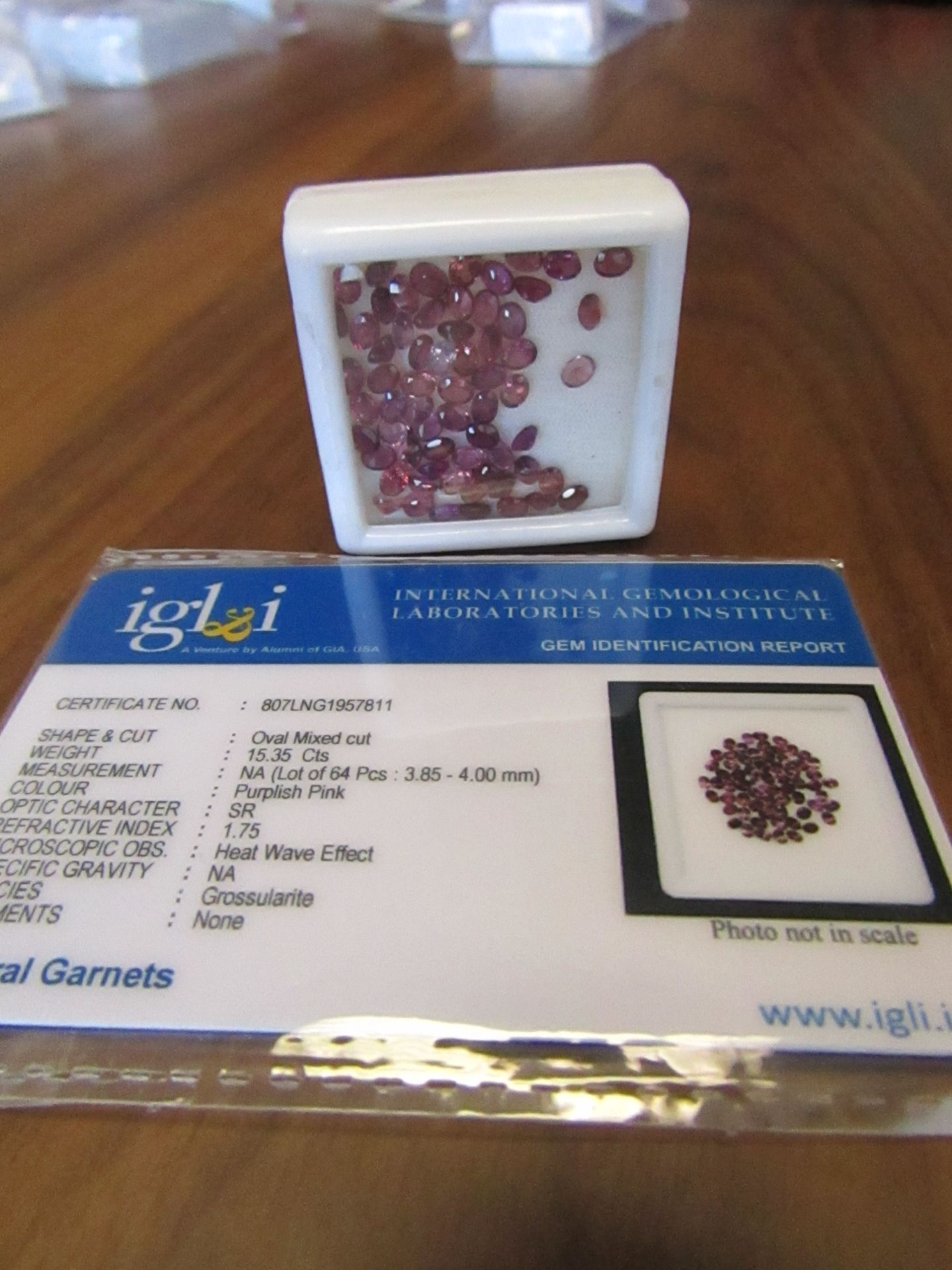 64 pieces Purplish Pink Natural Garnets Oval Mixed Cut. Total Weight 15.35 Carats. As per Gem