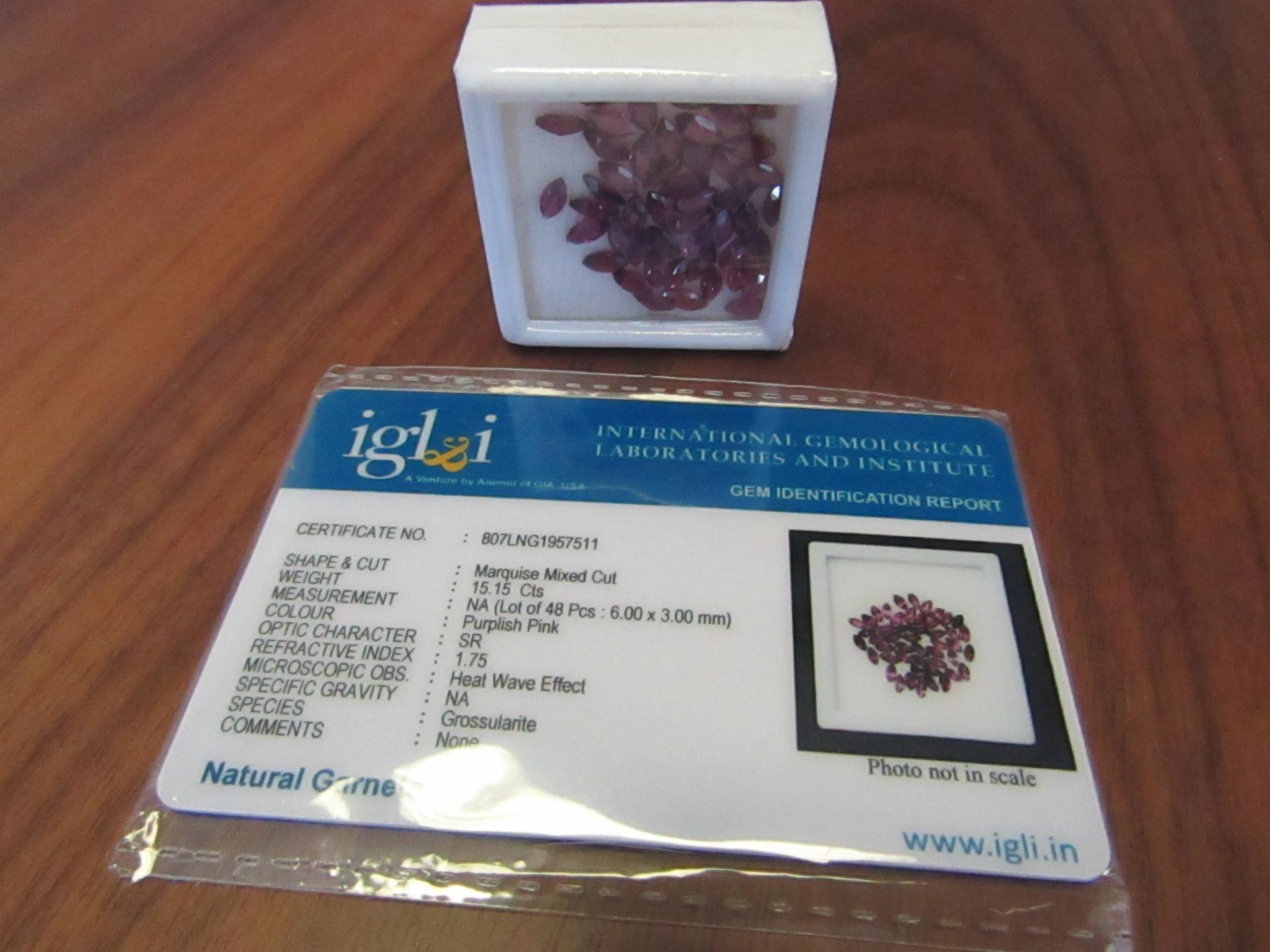 48 pieces Purplish Pink Natural Garnets. Marquise Mixed Cut. Total Weight 15.15 Carats. As per Gem