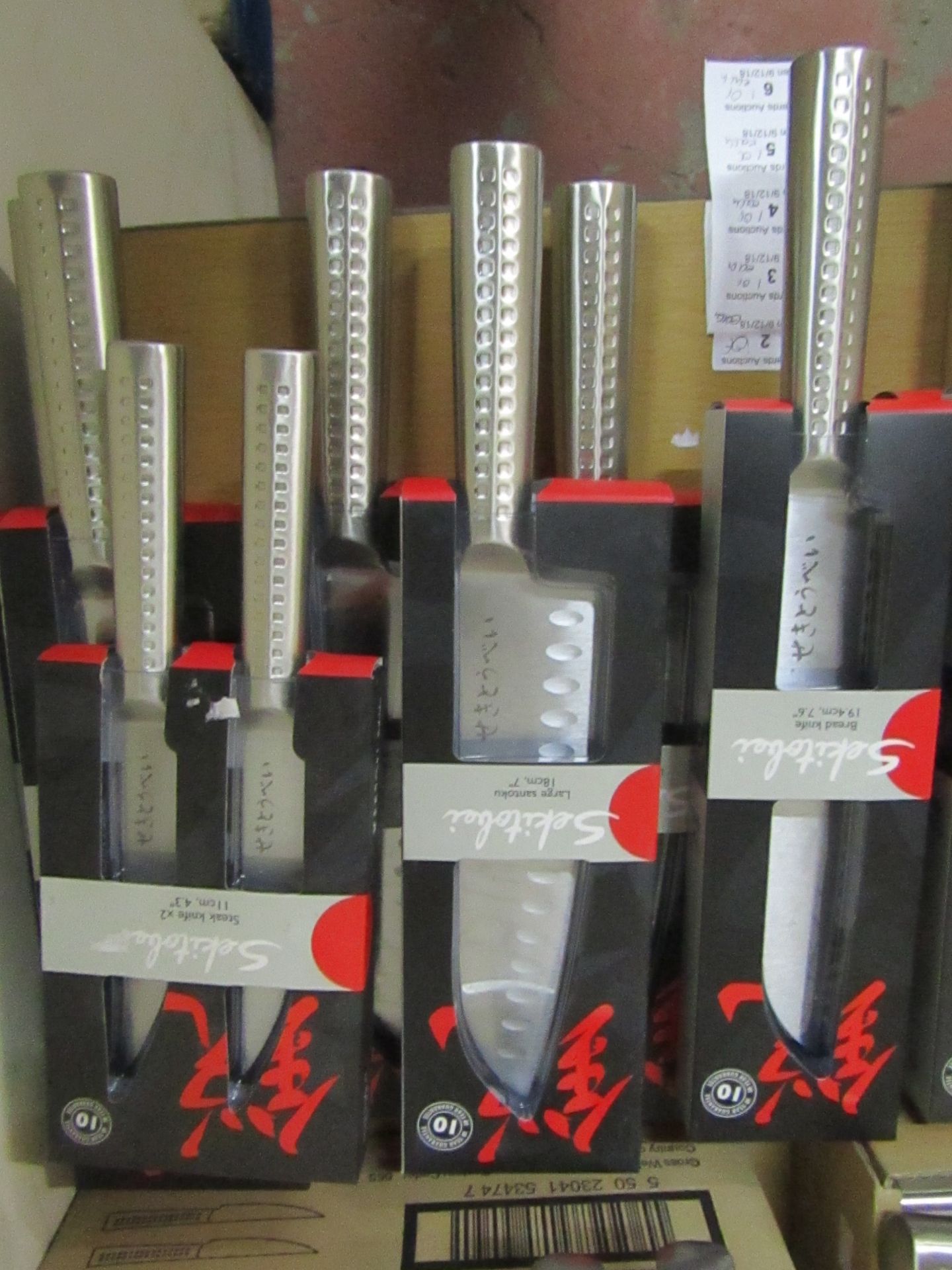 Set of 4x knives being: - Sekitobei bread knife 19.4cm, new - Sekitobei large santoku knife 18cm,