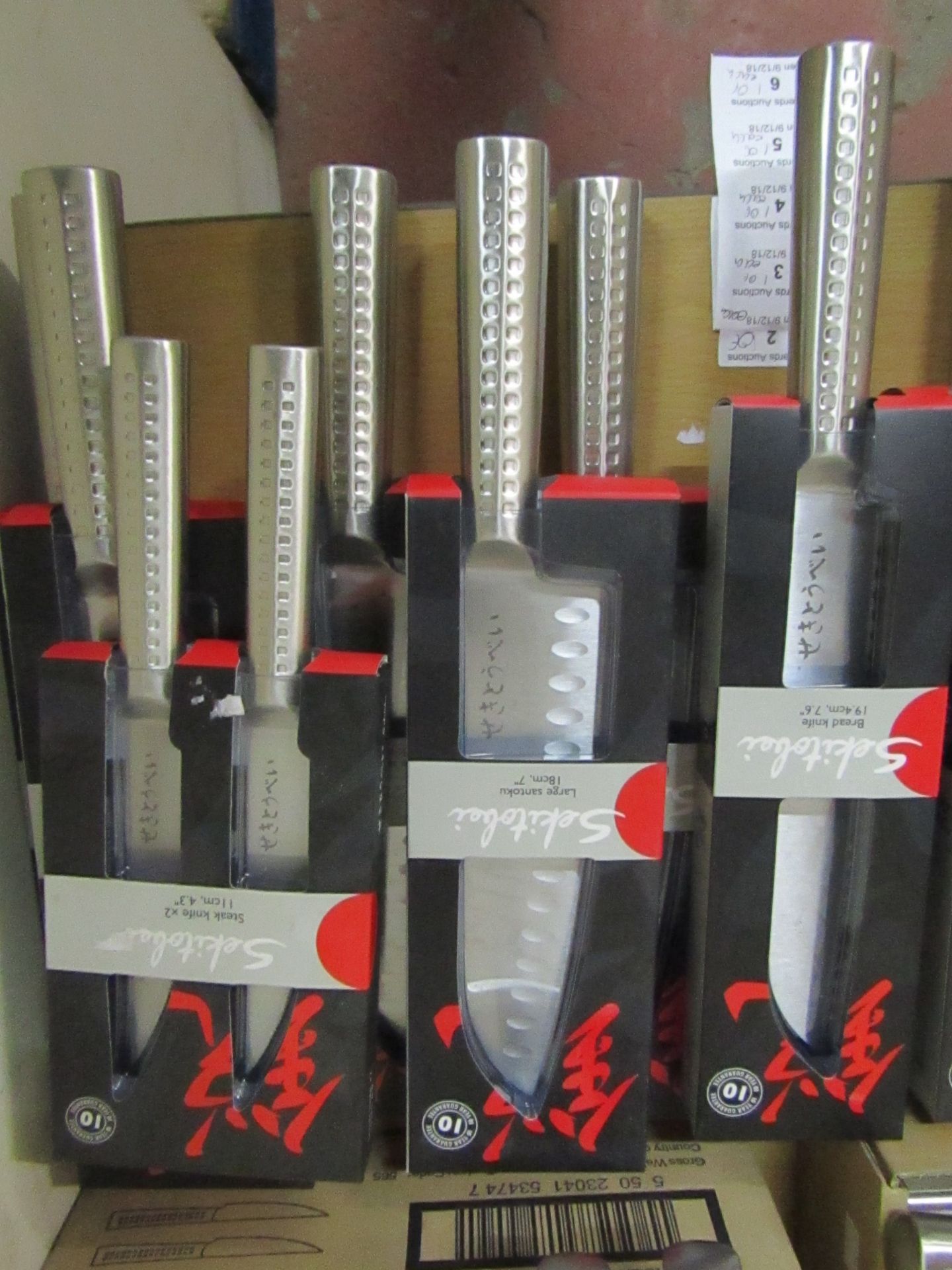 Set of 4x knives being: - Sekitobei bread knife 19.4cm, new  - Sekitobei large santoku knife 18cm,