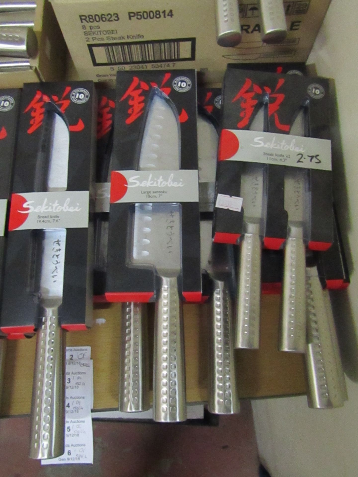 Set of 4x knives being: - Sekitobei bread knife 19.4cm, new  - Sekitobei large santoku knife 18cm,