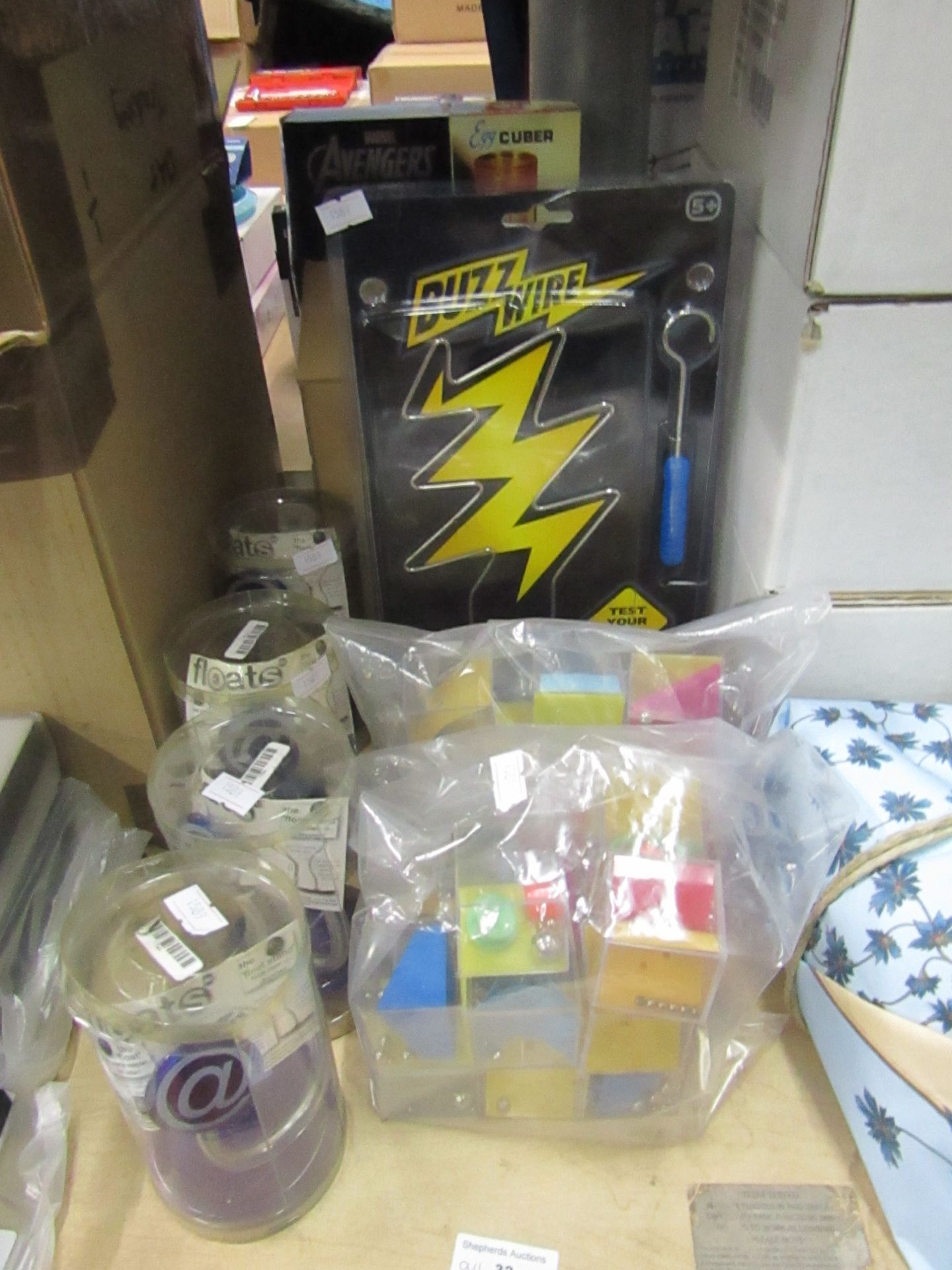 8x various items including: box of square egg makers, buzzwire steady hand game, 4x desk note