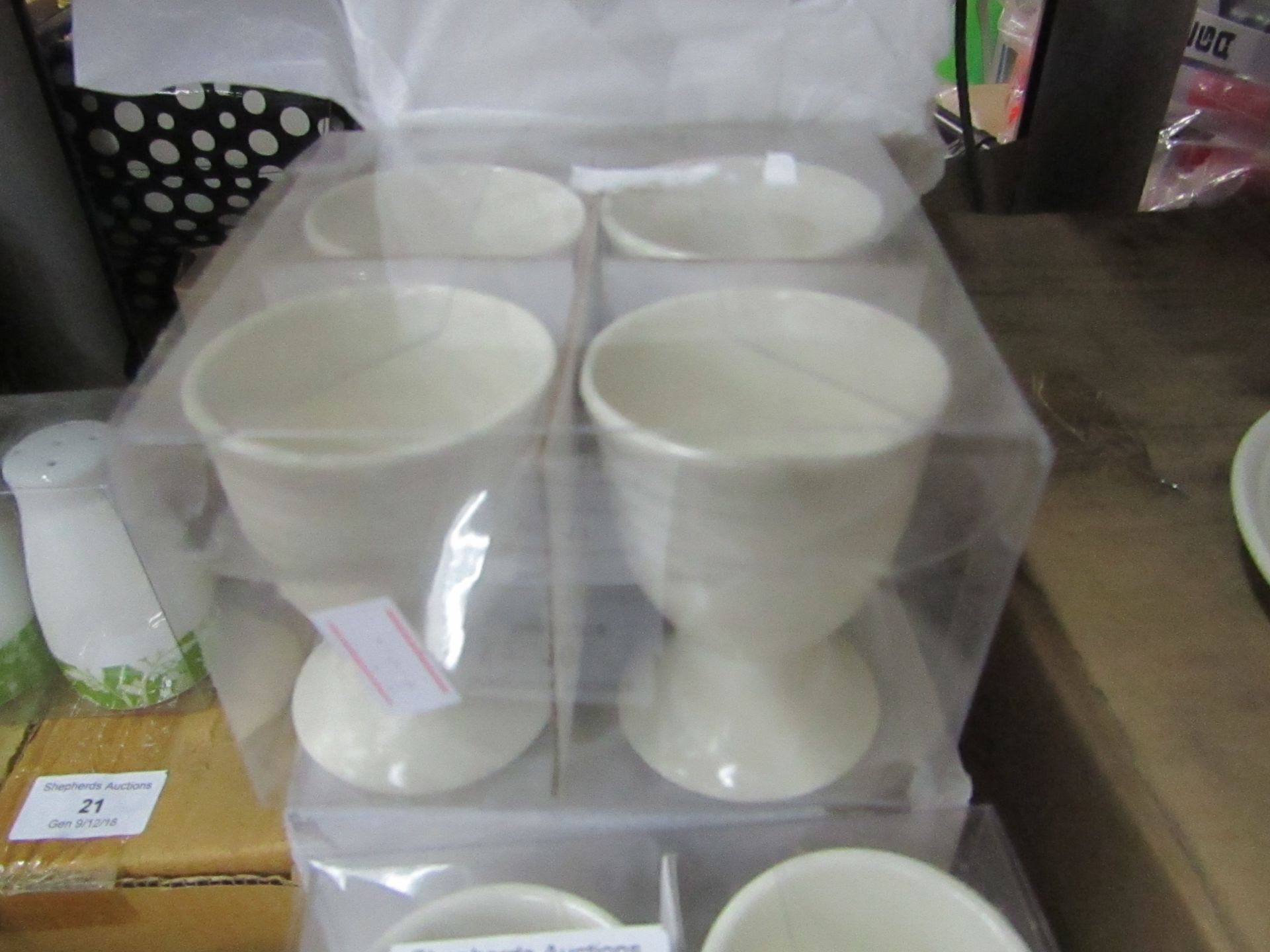 4x sets of 4x creme coloured egg cups, new