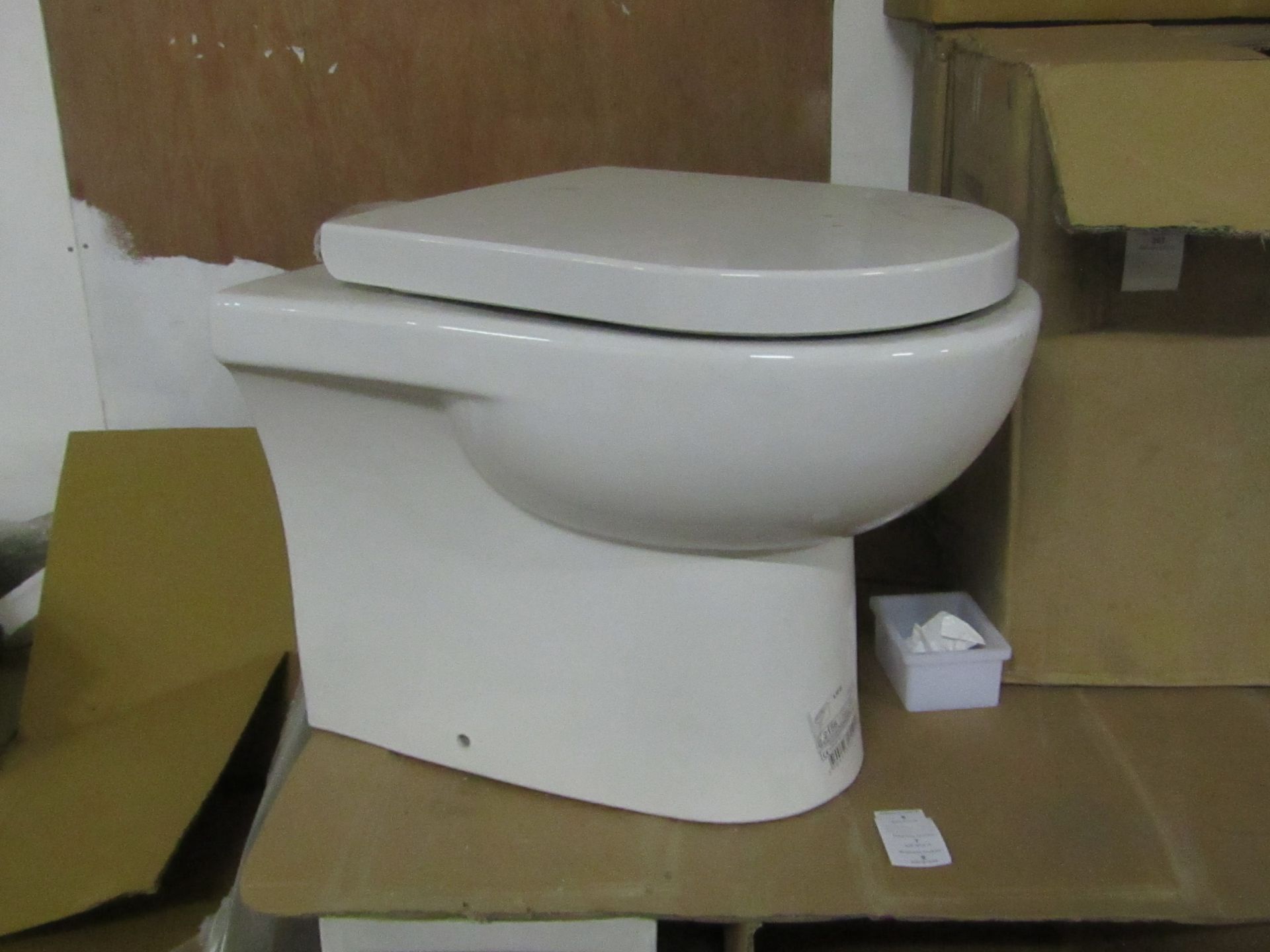 Laufen Life back to wall toilet pan, comes with matching toilet seat. Both new.