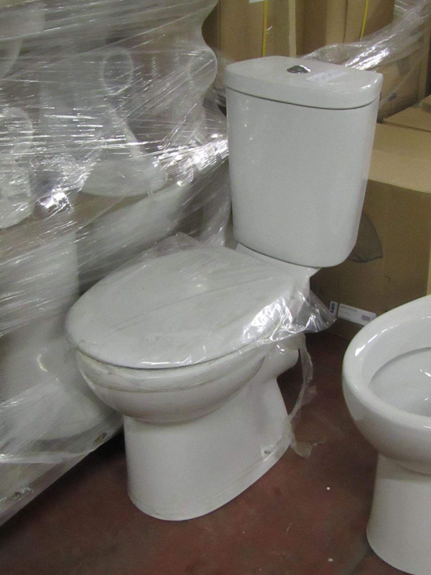 Unbranded Roca toilet pan with seat & cistern to match (also comes with flush system). All new &