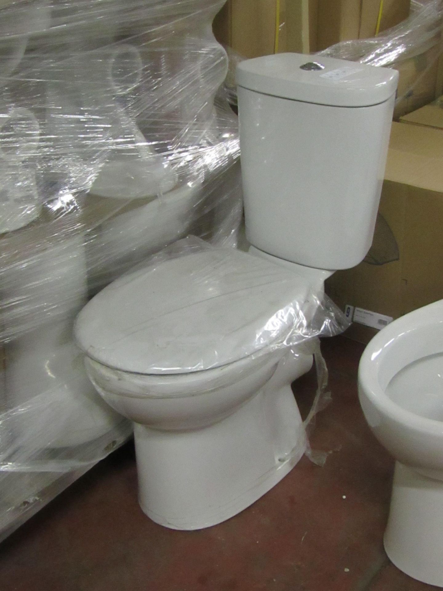 Unbranded Roca toilet pan with seat & cistern to match (also comes with flush system). All new &