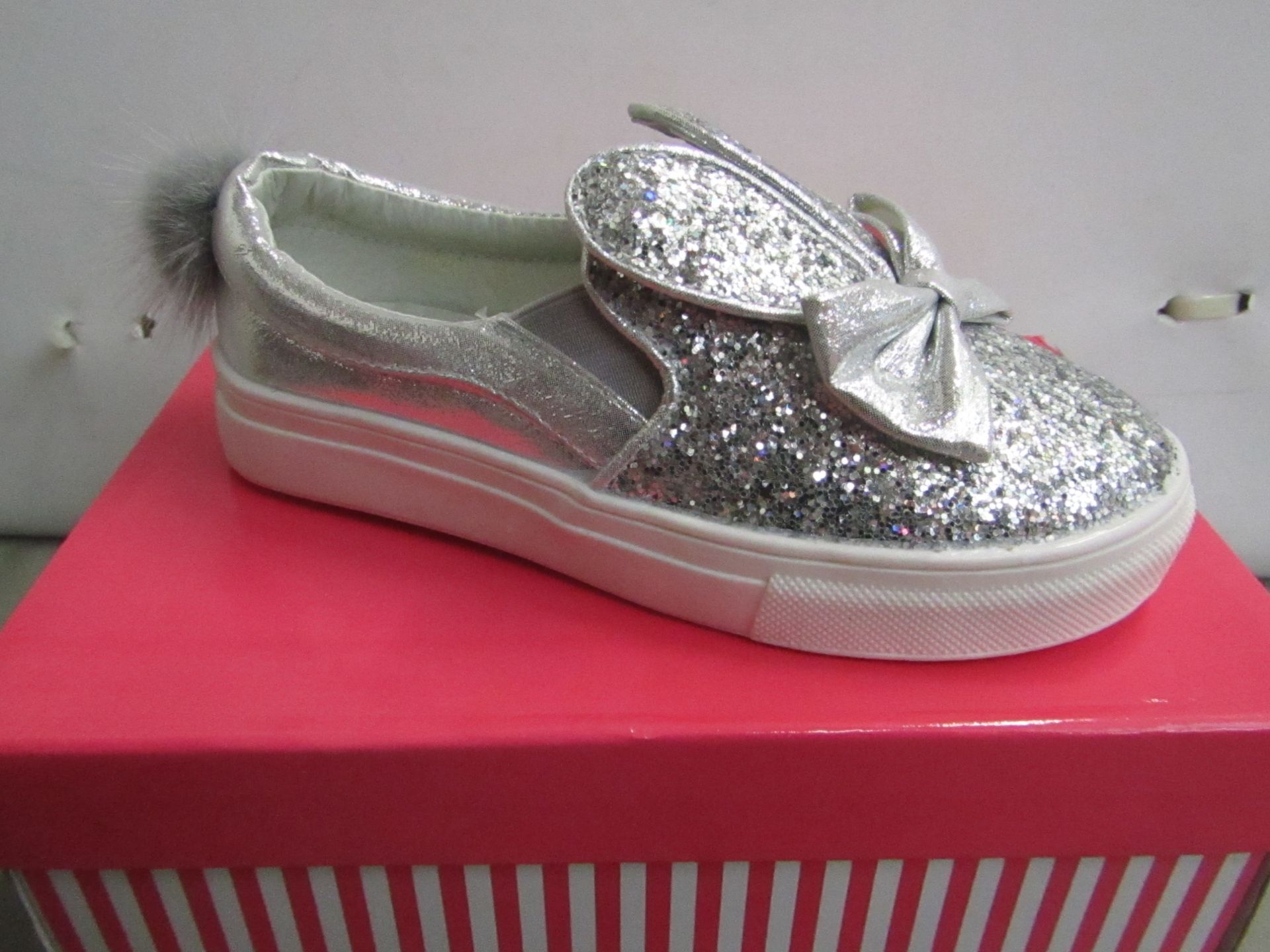Miss Sophia Girls silver shoe with sequence  design on the main body of the shoe also bow on