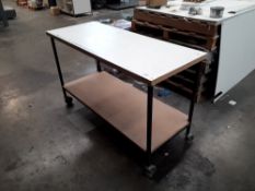 Mobile wooden table with steel frame