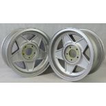 A pair of Ferrari Cromodora alloy wheels.