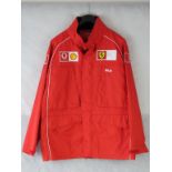 New red Ferrari Scuderria waterproof jacket.