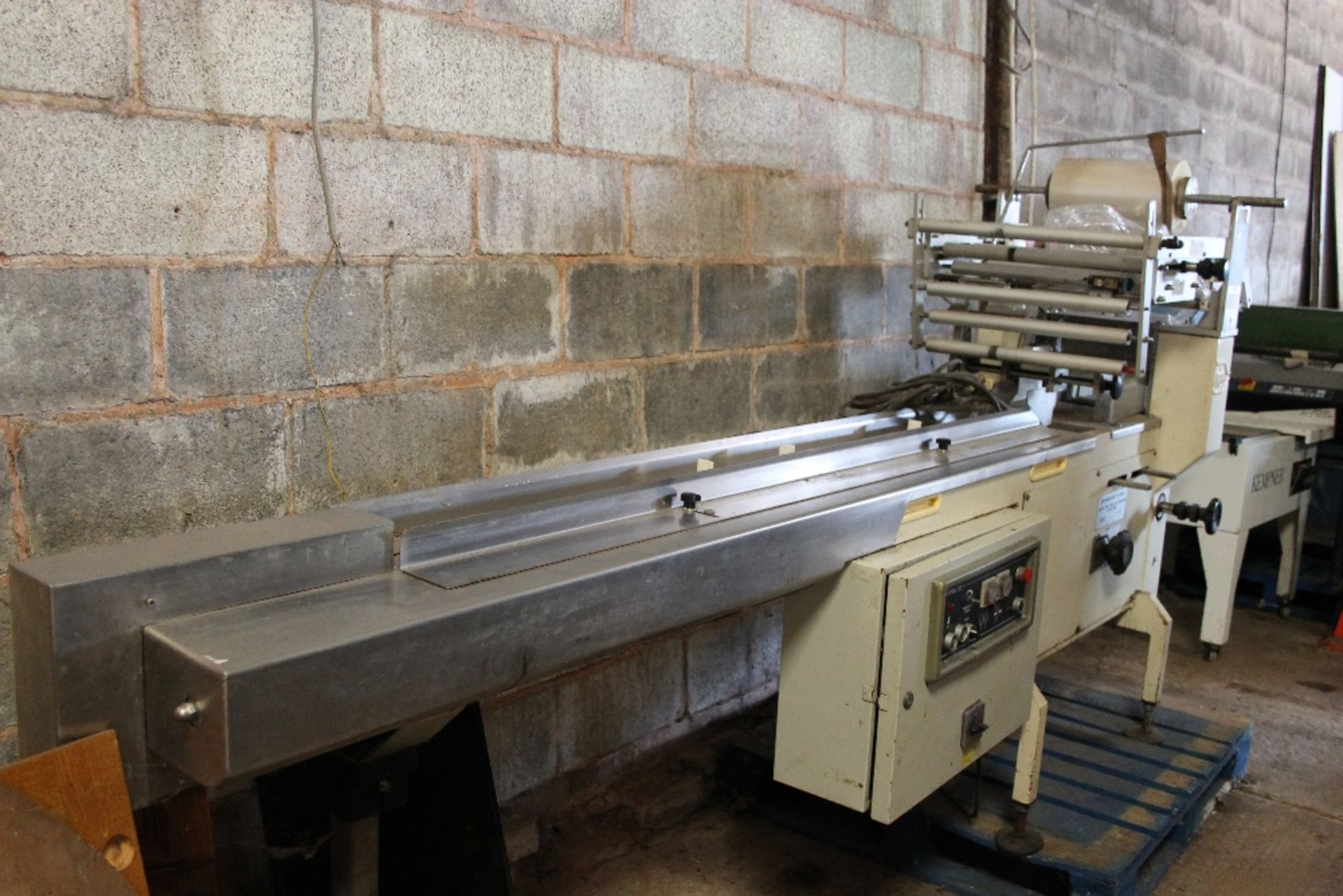 PFM 30 Flow Wrap Machine – 7ft run -1ph Working when taken out of production Tested Working - Lift