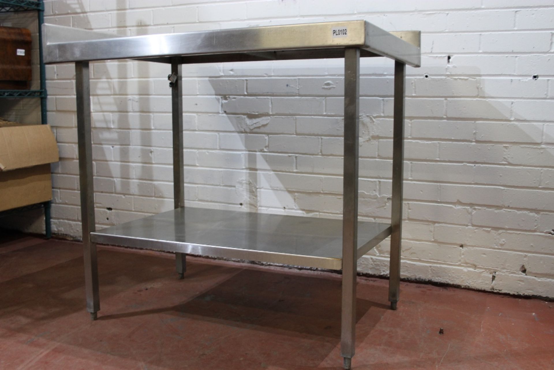 Stainless Steel Table with Under Shelf + Corner Splash Back – W100cm x H87 table surface H91 top