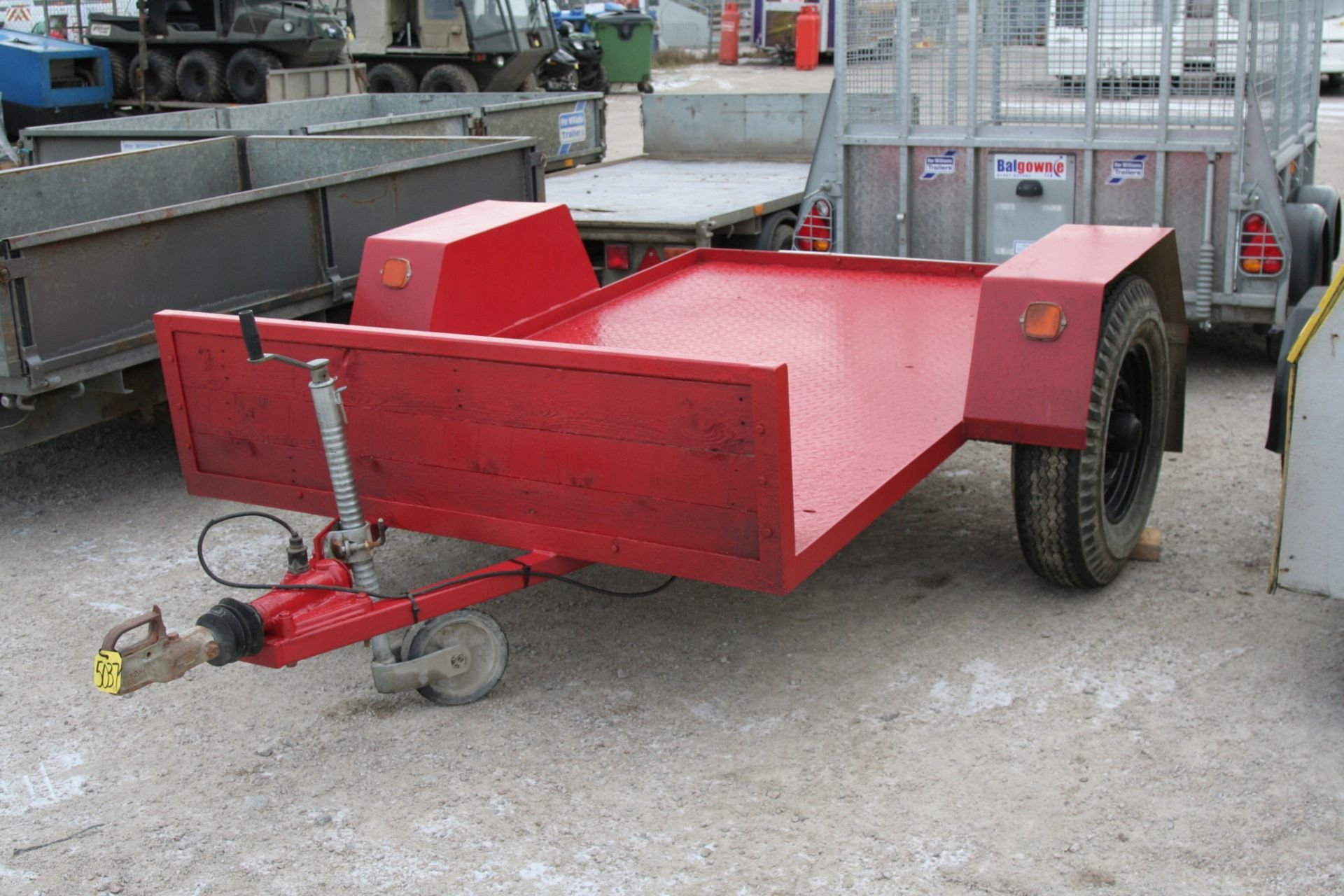 RED FLAT BED TRAILER