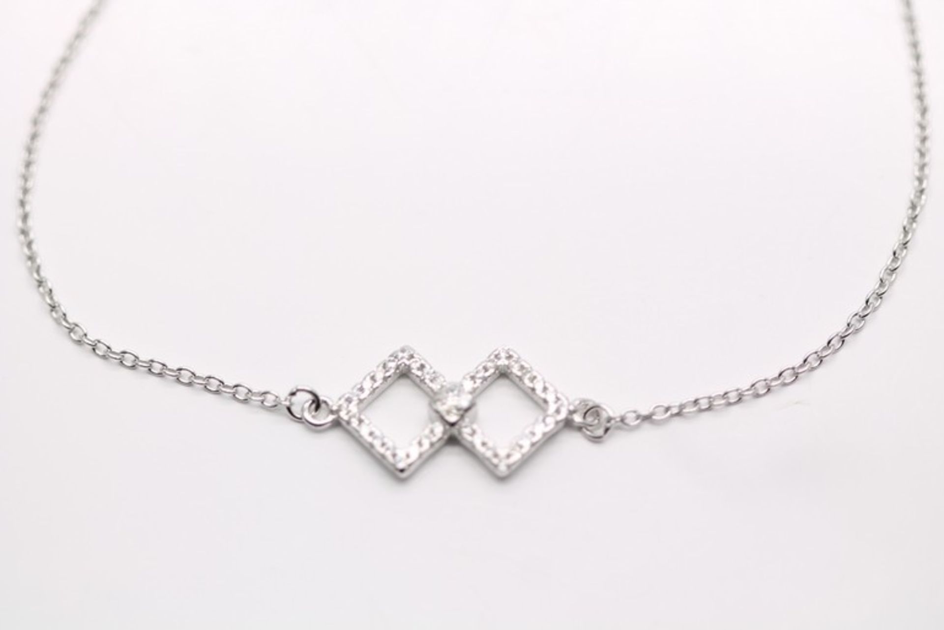 1 x BOXED BRAND NEW SOLID SILVER LADIES BRACELET WITH AAA+ SIMULATED DIAMONDS SET IN A SQUARE DROP