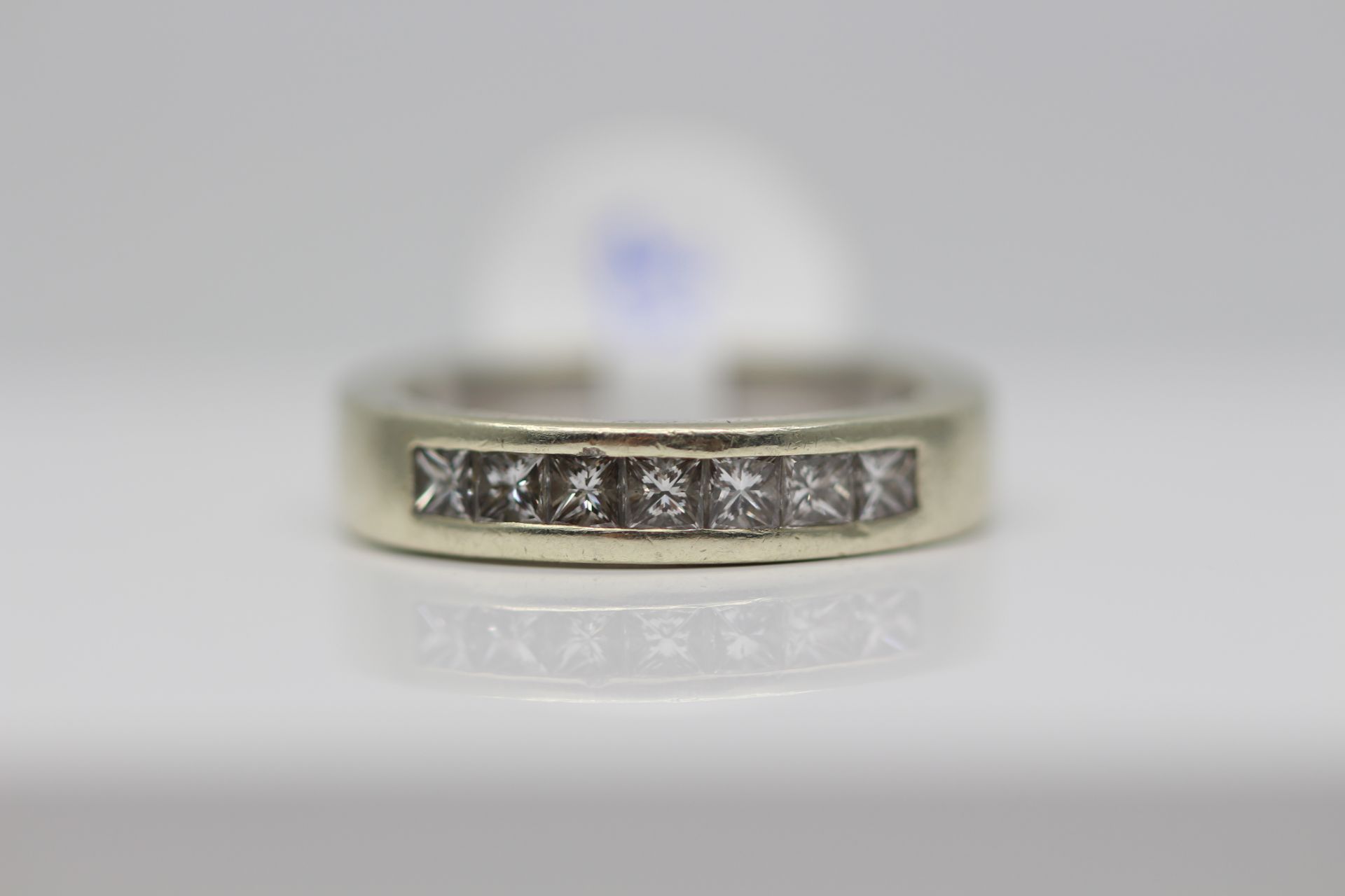 WHITE GOLD LADIES DIAMOND ETERNITY RING, SET WITH 0.63 CARATS OF PRINCESS CUT DIAMONDS