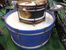 A small drum by Hawkes and Son, and a large drum