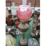 Table oil lamp with pink shade