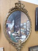 Oval mirror in ornate plaster frame, a/f