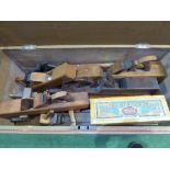 Very large carpenter's box containing various wooden hand planes, saw sets, bow saw etc