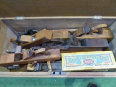 Very large carpenter's box containing various wooden hand planes, saw sets, bow saw etc