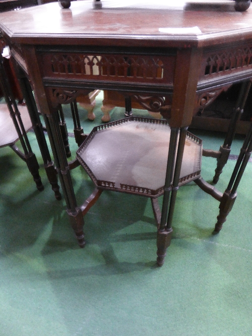 Octagonal ebonised display table with under shelf