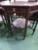 Octagonal ebonised display table with under shelf