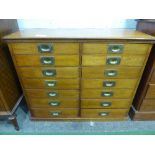 Mahogany storage cabinet with 2 sets of 7 storage drawers, 37' x 30' x 13.5' (depth) with contents