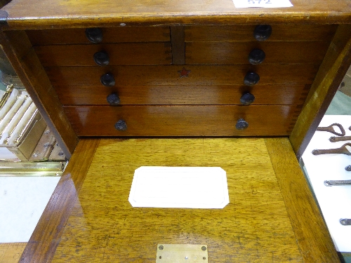 Mahogany portable cabinet with 7 drawers containing various Engineering items