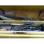 Pine carpenter's box containing various hand tools, bow saws, chisels etc