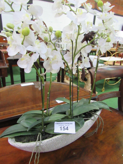 5 artificial orchids in long ceramic vase