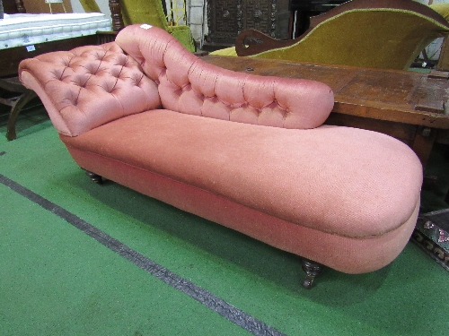 Pink upholstered chaise longue on casters, 57" x 27"