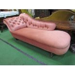 Pink upholstered chaise longue on casters, 57" x 27"
