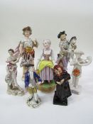 A collection of 7 figurines including Doulton Fagin