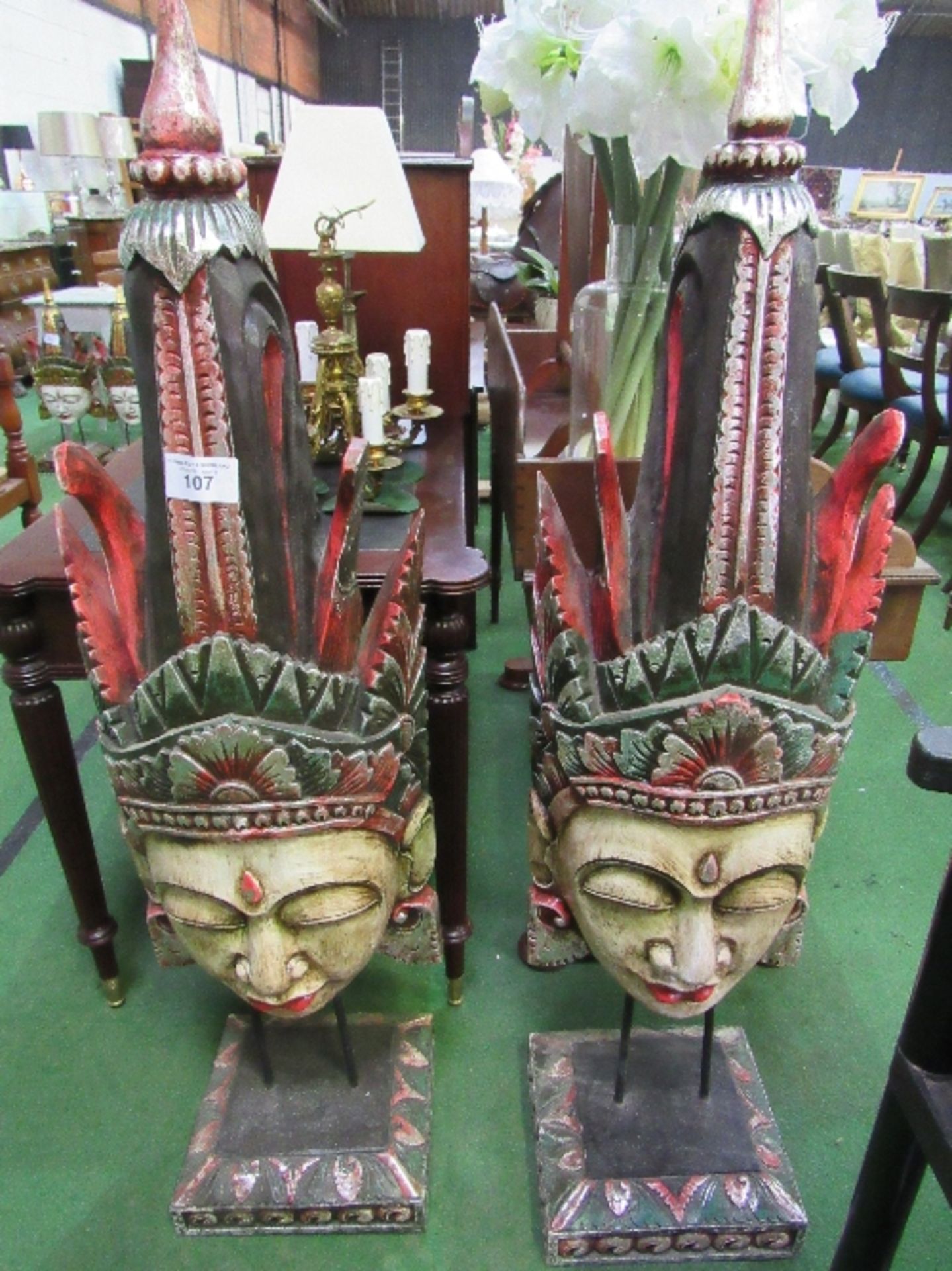 2 large carved wood Balinese female masks on stands