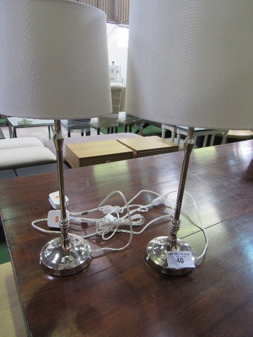 A pair of silver-coloured table lamps & shades