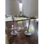 A pair of silver-coloured table lamps & shades