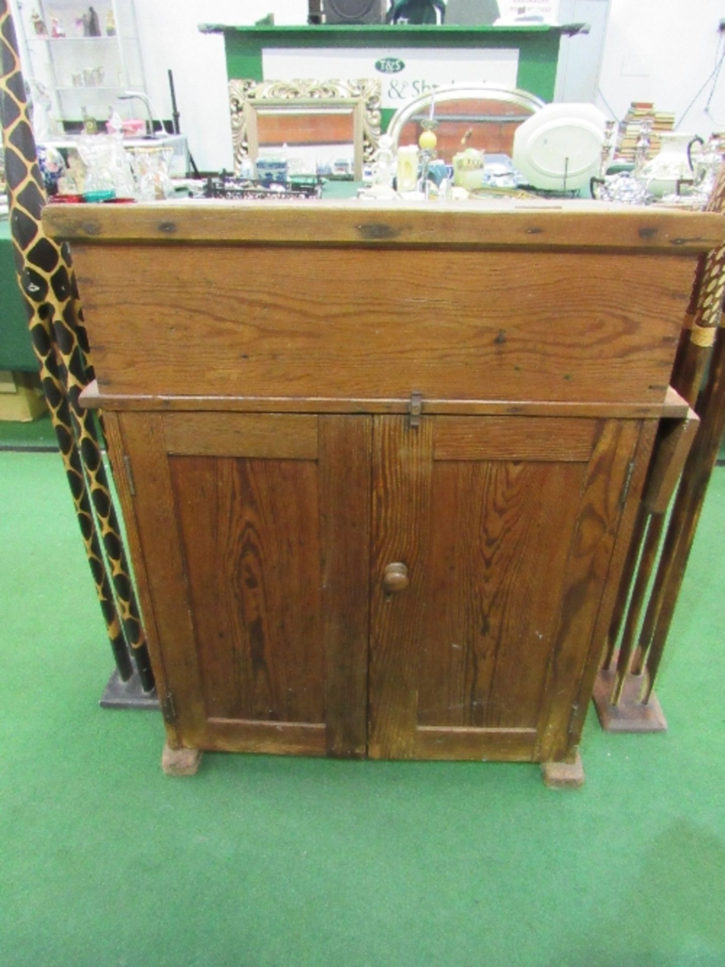 An antique pine 'Wake & Dean' school master's desk with rising lid, 2 ceramic inkwells, cupboard